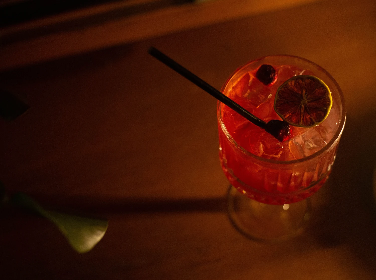The Midsummer cocktail at Vanagai: blackcurrant and aperitivo over ice, with dried lime and cranberries