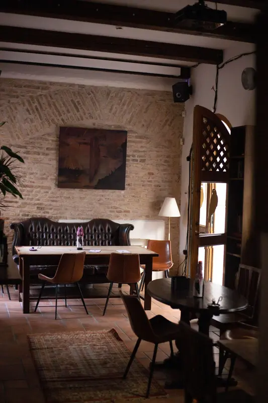 Brick wall with sofas and armchairs